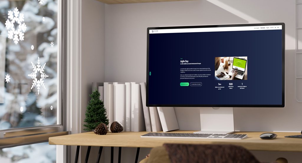 Bureau avec PC montrant la page du projet Agile Day pour le site rétrospectif 2023